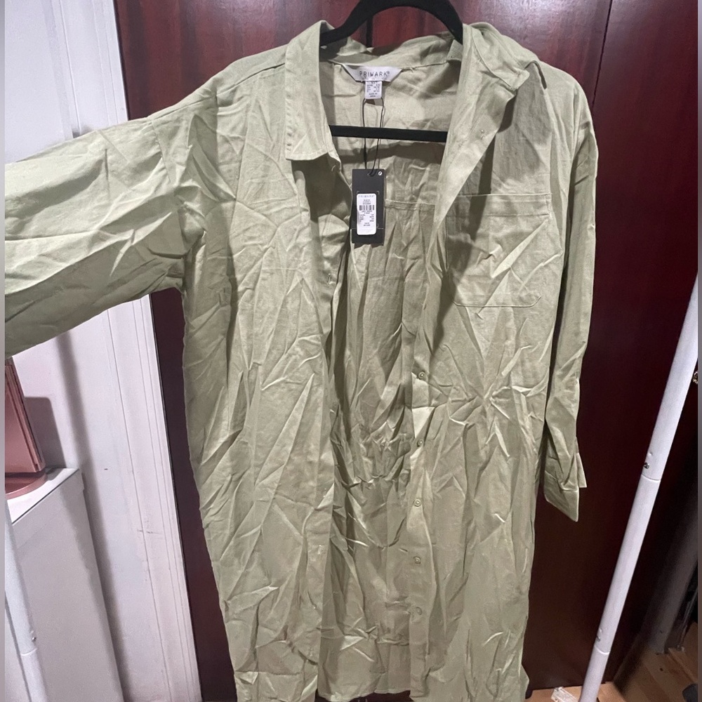 Modest green button up top